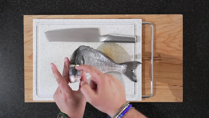 Prepare the fish: Make vertical incisions into the fish. Season lightly with salt. (Skip the starch coating if preferred)