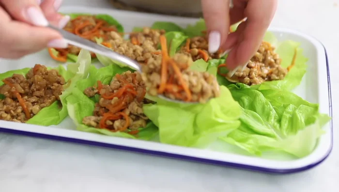 Serve the chicken mixture in lettuce cups.