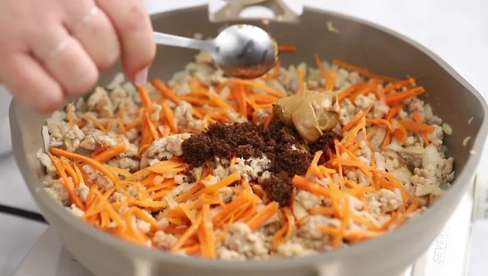 Add brown sugar, peanut butter, rice vinegar, and soy sauce. Mix well.