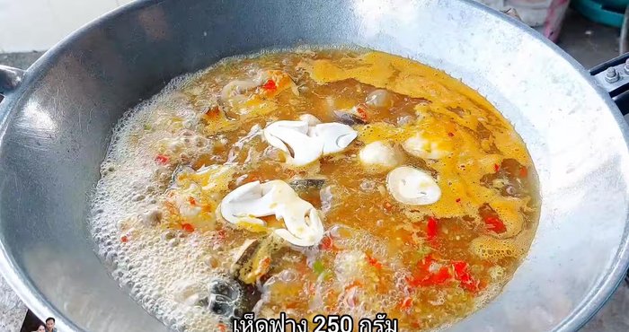 Once the catfish is partially cooked, add straw mushrooms (250g) and optional Meiji mushrooms.