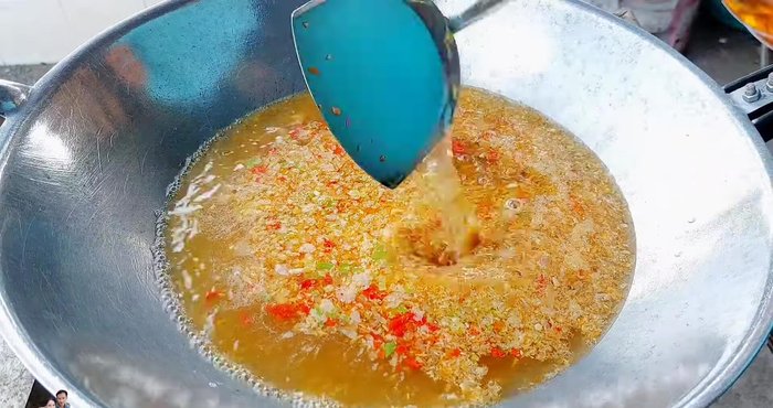 Add fish sauce (2 spatulas/4 spoons), seasoning powder (1 tsp), and optional MSG.