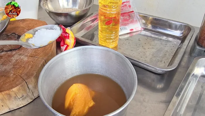 Prepare the dipping sauce: Combine tamarind juice, granulated sugar, palm sugar, salt, powdered milk, pickled garlic, and chili powder. Simmer until slightly sticky.