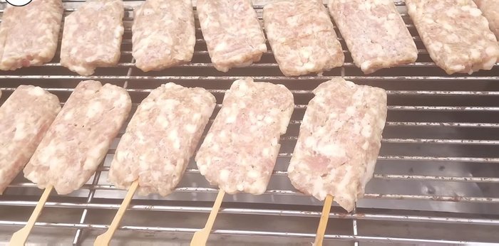 Grill the pork skewers over medium heat, turning occasionally.