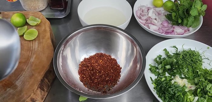 Prepare the Jaew Sauce: Fry chili powder until fragrant. Add fish sauce, lime juice, and MSG powder. Adjust seasoning as needed.