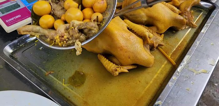 After cooking, transfer the chicken to a bowl of water to maintain skin integrity.