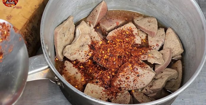 Prepare the sauce: Mix ground chili, roasted rice powder, fish sauce, lime juice, and sugar (optional) according to your preference.
