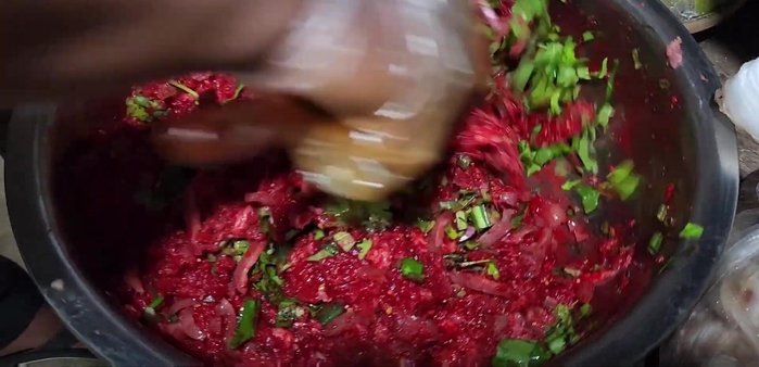 Adjust seasoning: Taste and add more fish sauce, lime juice, and chili powder as needed. The video highlights continuous tasting and adjustment.