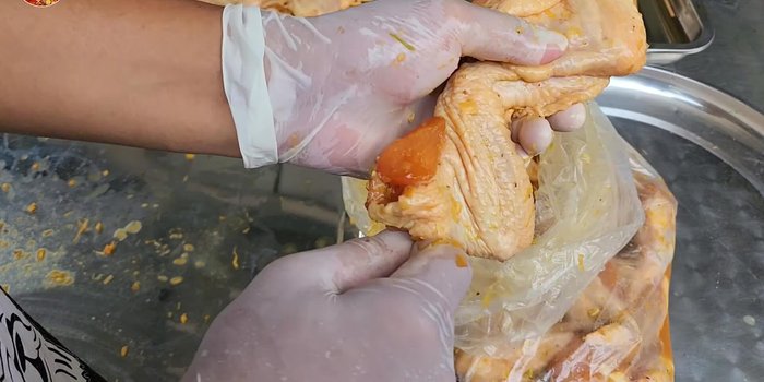 Skewer the marinated chicken.