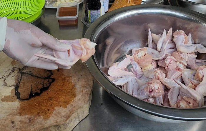 Make incisions on the chicken to help the marinade penetrate.