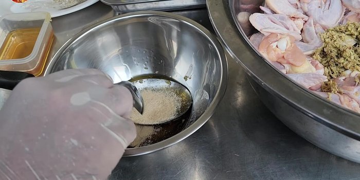 Marinate the chicken: Combine the herbs, honey, chicken seasoning powder, salt, white soy sauce, oyster sauce, sugar, and a little yellow food coloring.