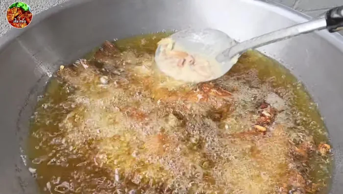 Sprinkle the pounded garlic over the fish during frying.