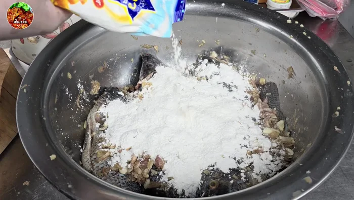Coat the marinated tilapia in the batter.