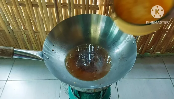 Add the egg and glass noodle mixture to the pan. Stir continuously to prevent sticking and burning.