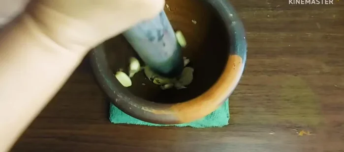 Pound garlic until fine. (76.68)