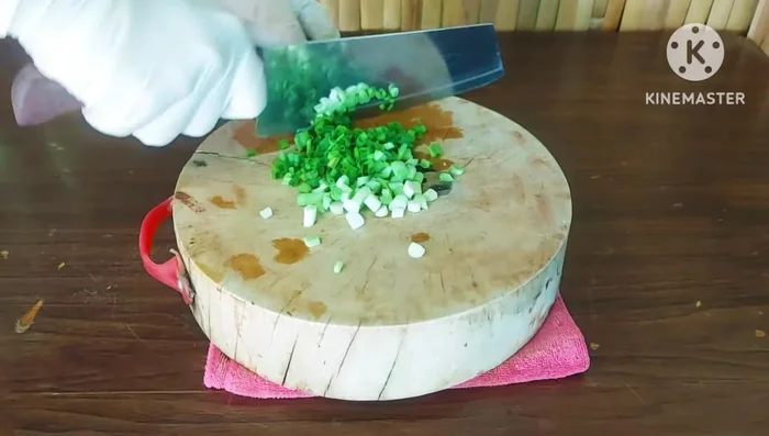 Add chopped spring onions (and coriander, if available) and mix well.