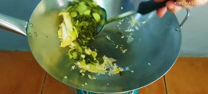 Add pickled cabbage and stir-fry until well combined.
