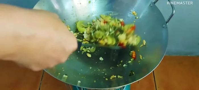 Add chili peppers (optional) and stir-fry.