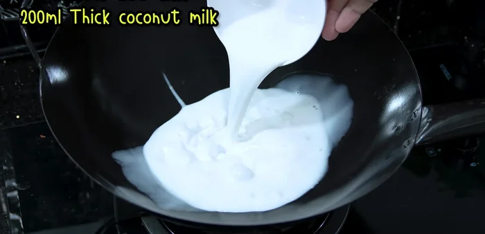 Heat coconut milk (200ml) over low heat until it boils, then simmer.
