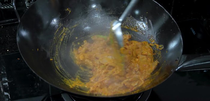 Continue stir-frying until the pork is cooked and the sauce thickens.