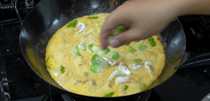 Add the salted eggplant and increase heat to a boil, helping it cook faster and prevent blackening.