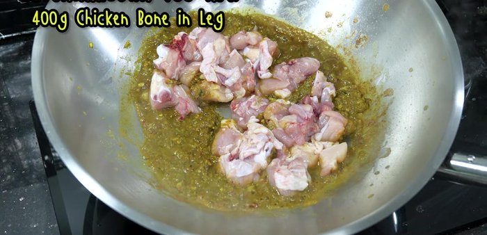 Add the chicken thighs, then the giblets. Stir-fry until cooked.