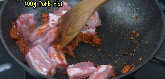 Add the pork ribs and stir-fry until golden brown on all sides.