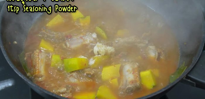 Season with palm sugar, pork seasoning powder, and fish sauce. Stir to combine and let the sugar melt.