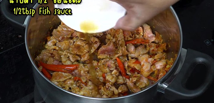 Season with fish sauce and add kaffir lime leaves. Stir-fry until boiling.