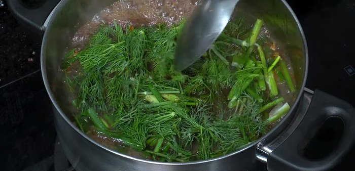 Add chopped spring onions and coriander. Simmer until desired consistency is reached.