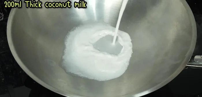 Simmer the first pressing of coconut milk in a pan over low heat until it separates to your liking.