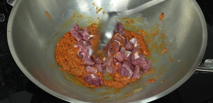 Add the pork and stir-fry until cooked through.
