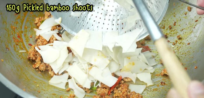 Add the blanched pickled bamboo shoots.