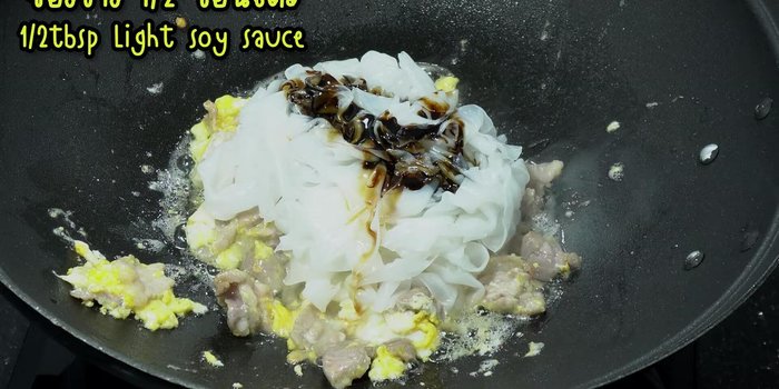 Add dark soy sauce, light soy sauce, and sugar. Stir-fry until well blended and the desired color is achieved.