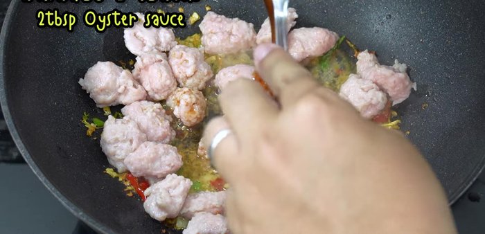 Add oyster sauce, fish sauce, green cap soy sauce, and sugar (or MSG). Stir-fry until well combined.