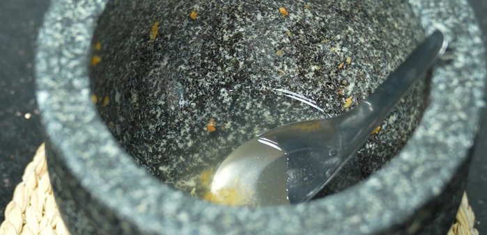 Wash the mortar and pestle and reserve the water.