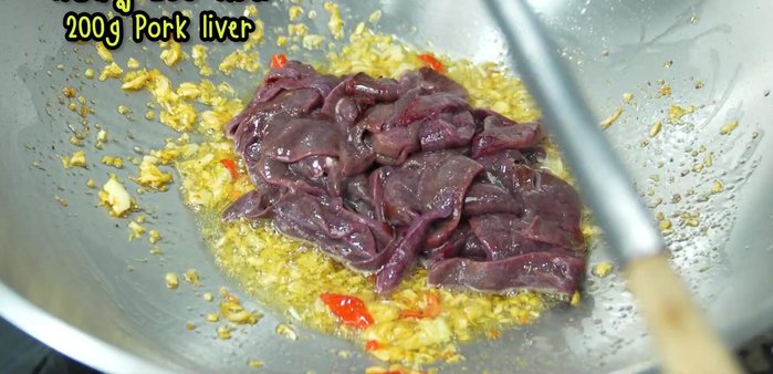 Add the pork liver and increase the heat. Stir-fry until cooked but still tender.