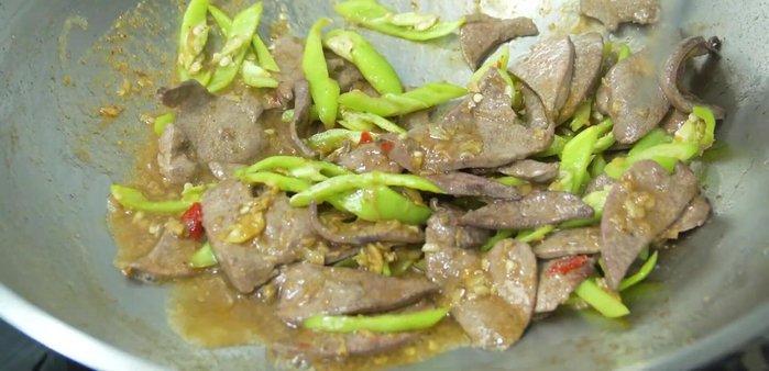 Stir-fry until everything is well combined. Add chopped spring onions and stir-fry briefly until fragrant.