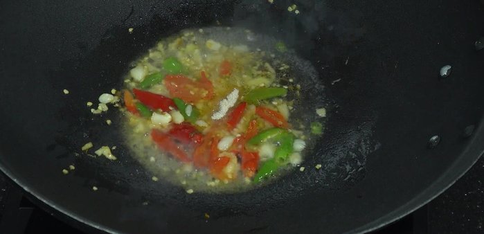 Increase heat. Add seasoning powder, sugar, fish sauce, green-capped soy sauce, and oyster sauce. Stir-fry until well combined.