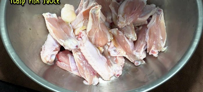 In a bowl, combine fish sauce, green-capped seasoning sauce, chicken seasoning powder, sugar, and ground pepper.