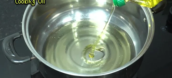 Heat oil in a frying pan or pot. Once hot, add the chicken wings, ensuring they are not overcrowded.