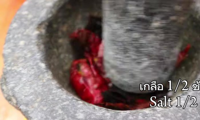 Prepare the beef by slicing it into thin strips. Marinate with soy sauce, fish sauce, oyster sauce, sugar and garlic.