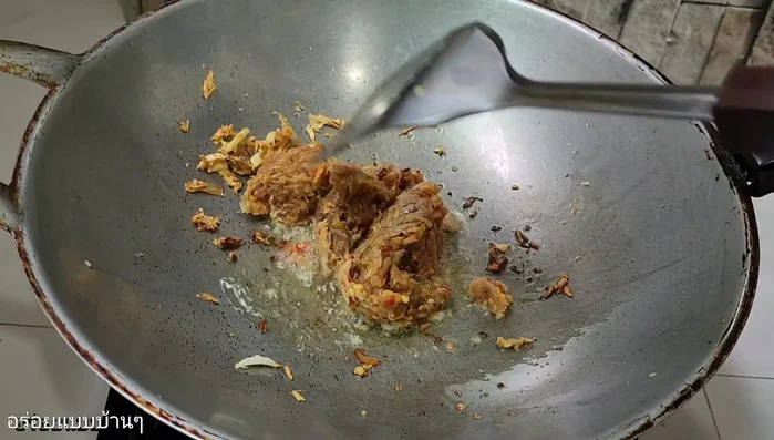 Add the pounded pork mixture to the pan and stir-fry until cooked and fragrant. Season with fish sauce (or salt/MSG).