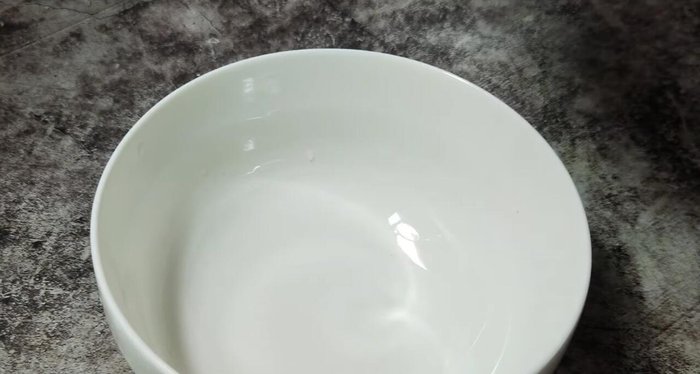 Crack 3 eggs into a cup.