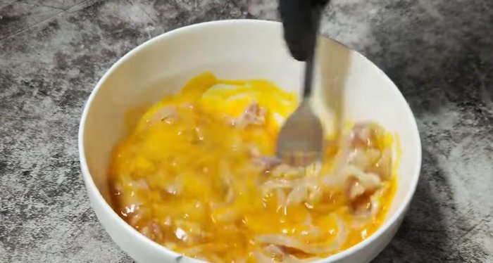 Beat the eggs, sausage, and seasoning ingredients together until slightly bubbly.