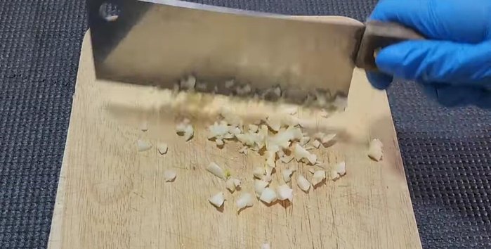 Prepare shrimp stock by boiling shrimp shells and heads.
