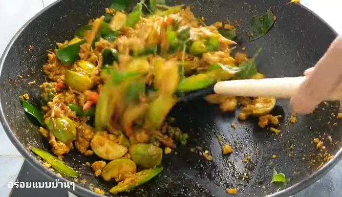 Add basil leaves and stir-fry until wilted.