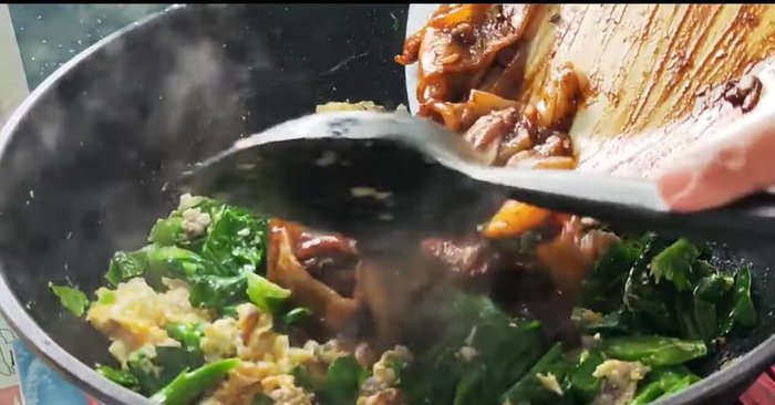 Add wide noodles and stir-fry.