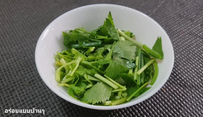 Chop spring onion and coriander into sections.