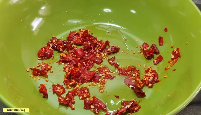 Prepare the dressing: In a bowl, combine pounded chili, fish sauce, sugar/syrup, lime juice, and MSG (optional). Add water if needed for desired consistency.