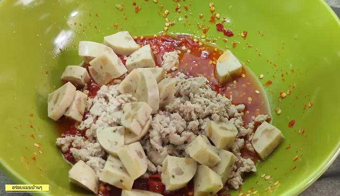 Add cooked glass noodles and mushrooms to the dressing and mix thoroughly.